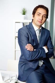 Portrait of a successful employer in formalwear looking at camera