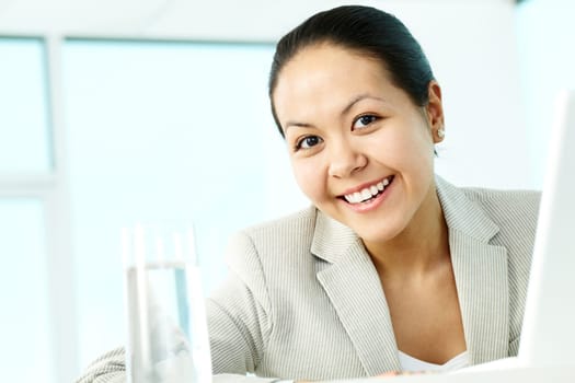 Portrait of smiling businesswoman looking at camera