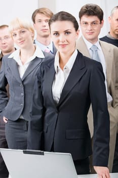 Business team with a businesswoman leading it