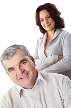 Portrait of happy mature man looking at camera with woman on background