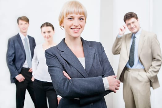 Photo of beautiful female leader on the background of her business team
