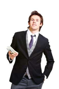 Portrait of successful businessman in elegant suit holding dollars