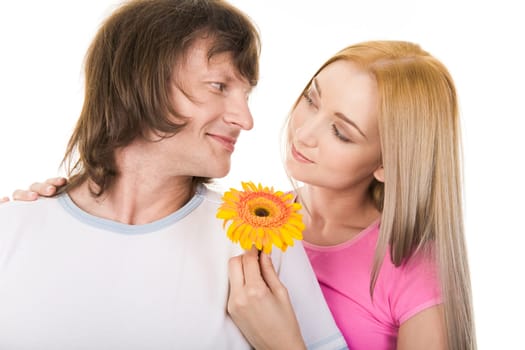 Portrait of loving couple looking at each other over white background