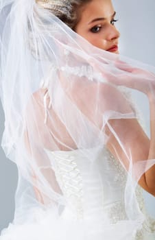 Portrait of pretty bride posing in isolation