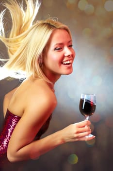 Portrait of young happy girl dancing with wine glass