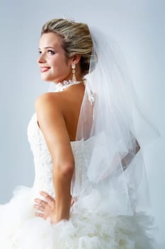 Portrait of pretty bride posing in isolation