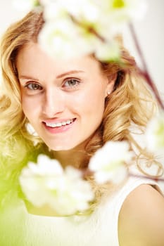 Charming girl with curly hair looking at camera