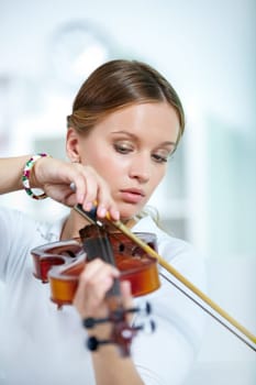 Portrait of a young female playing the violin