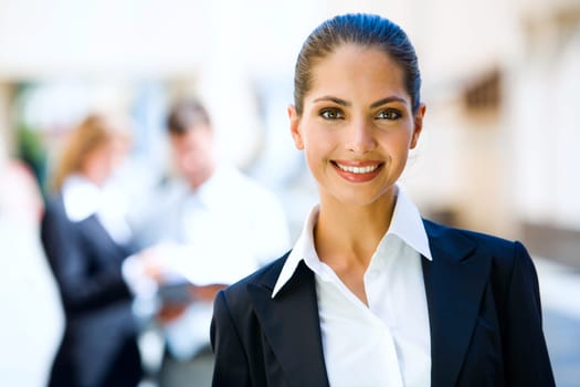 Successful young business woman with charming confident smile