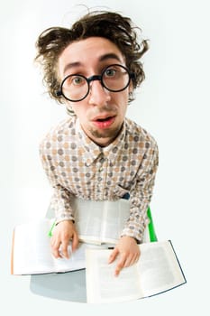 Image of tired student with glasses looking at camera