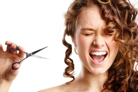 Image of screaming young girl trying to cut her hair off