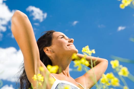 Portrait of smiling beautiful girl enjoying sun outside