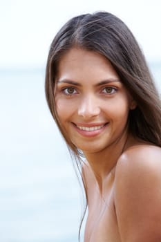 Portrait of fresh woman on the background of water