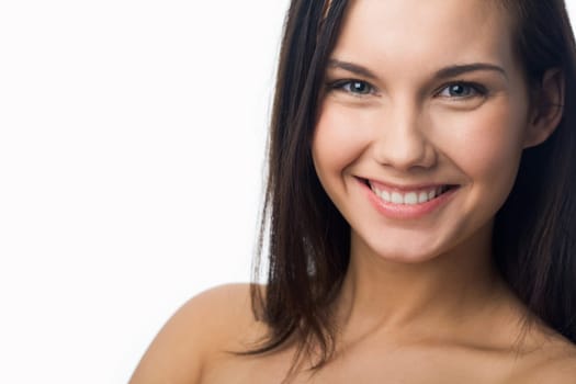 Portrait of charming girl looking at camera and laughing