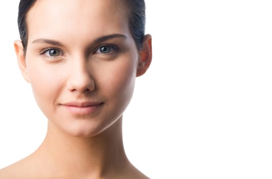 Portrait of charming girl looking at camera over white background