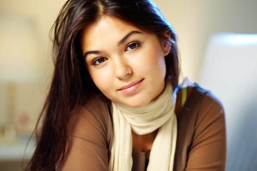 Portrait of beautiful brunette girl looking at camera