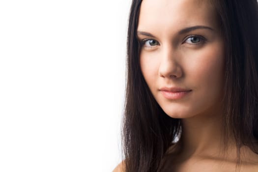 Portrait of charming girl looking at camera over white background