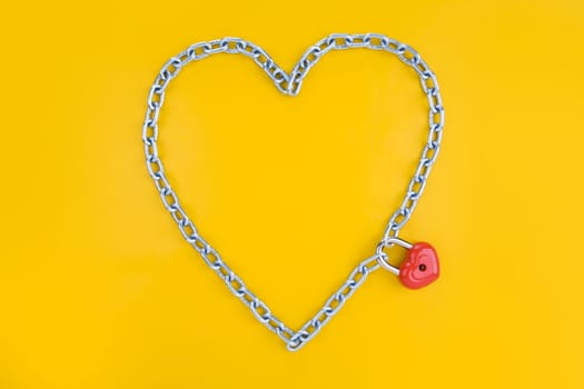 Chain forming heart shape being joined by a lock