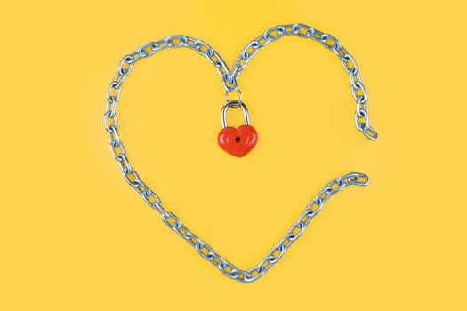 Image of heart made of iron with lock on the middle