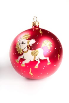 Red christmas ball with portrayal of pony