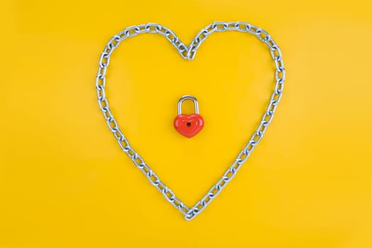View of heart-shaped lock surrounded by chain