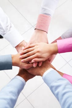 Close-up of business peoples hands on top of each other