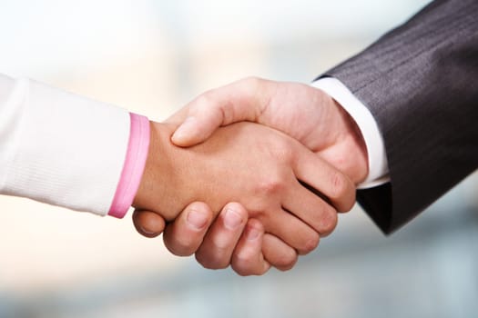 Image of partners handshake after signing contract