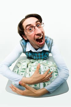 Portrait of greedy male raking in dollars and being glad