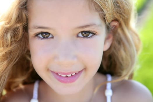 beautiful little girl portrait smiling closeup face looking camera
