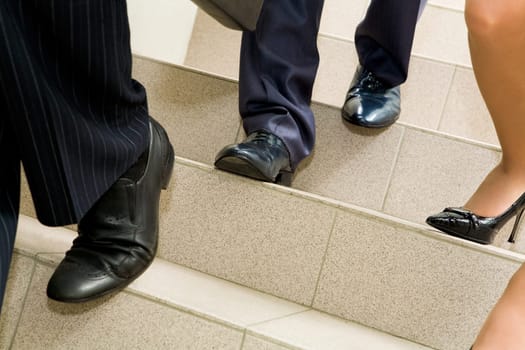 Image of female and male legs going downstairs