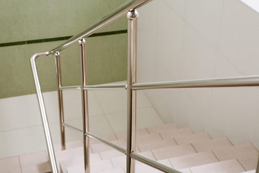 Image of marble ladder in office building between floors