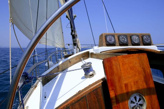 Sailing with an old sailboat over blue mediterranean summer sea