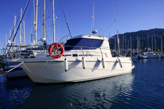 Sport fishing vacation boat on Mediterranean marina on blue water