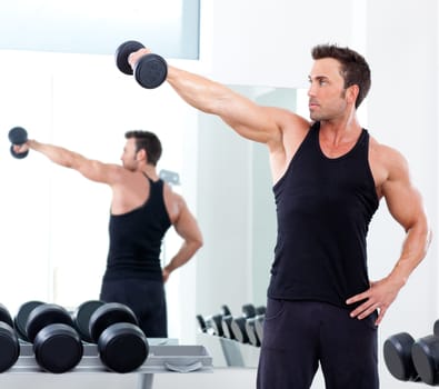 man with weight training equipment on sport gym club