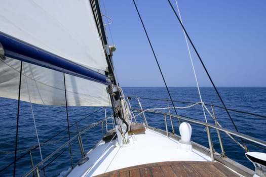 Sailing with an old sailboat over blue mediterranean summer sea