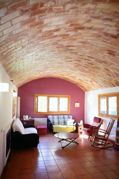 Nice living room with barrel vault on clay bricks, Mediterranean interior house
