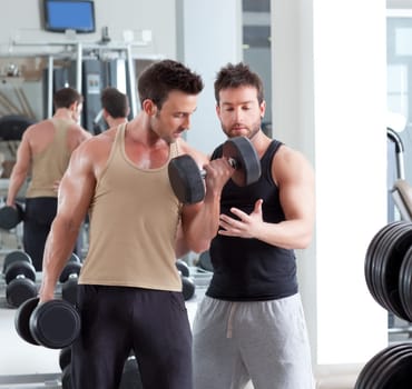 gym personal trainer man with weight training equipment