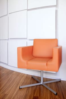 Modern office lobby interior design, orange leather chair , wooden floor