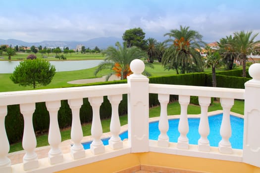 Golf course view from house with pool white balustrade