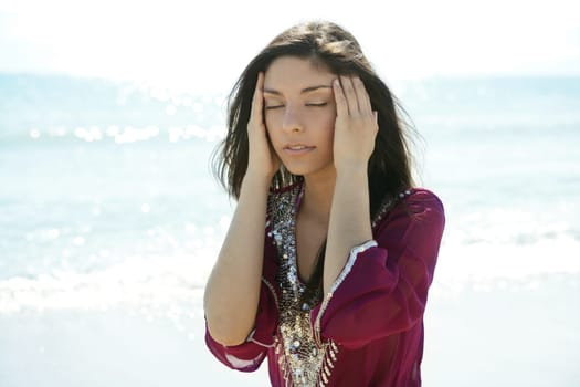 beautiful indian woman relaxing on the beach