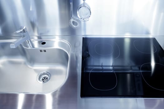 Kitchen silver sink and vitroceramic stove hob modern decoration