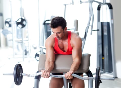 man with weight training equipment on sport gym club