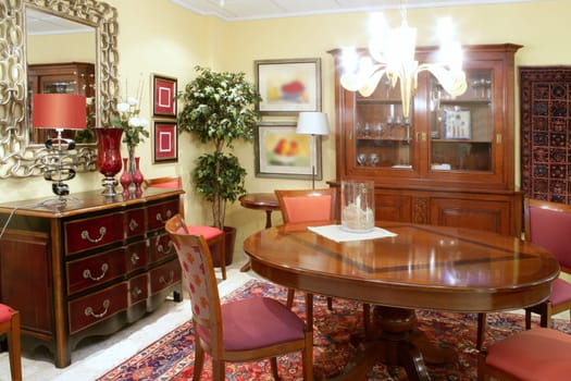 Classic living room table warm wood furniture glowing chandelier