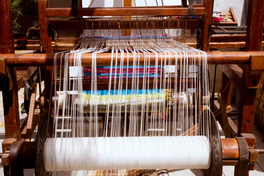 antique vintage spinner machine working in mediterranean fabric