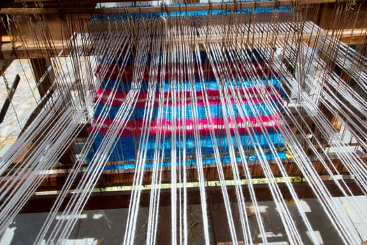 antique vintage spinner machine working in mediterranean fabric