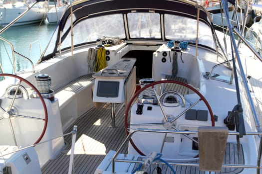 double wheel sailboat stern deck area moored in marina