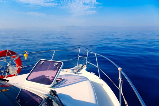 Blue sea boat sailing with open bow porthole in summer vacations