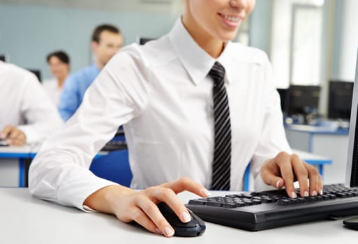 Woman office worker using computer on her workplace
