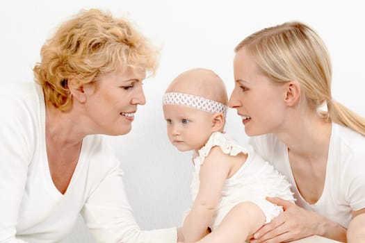 Portrait of happy grandmother, mother and cute baby girl