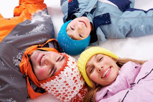 Above angle of happy family looking at camera